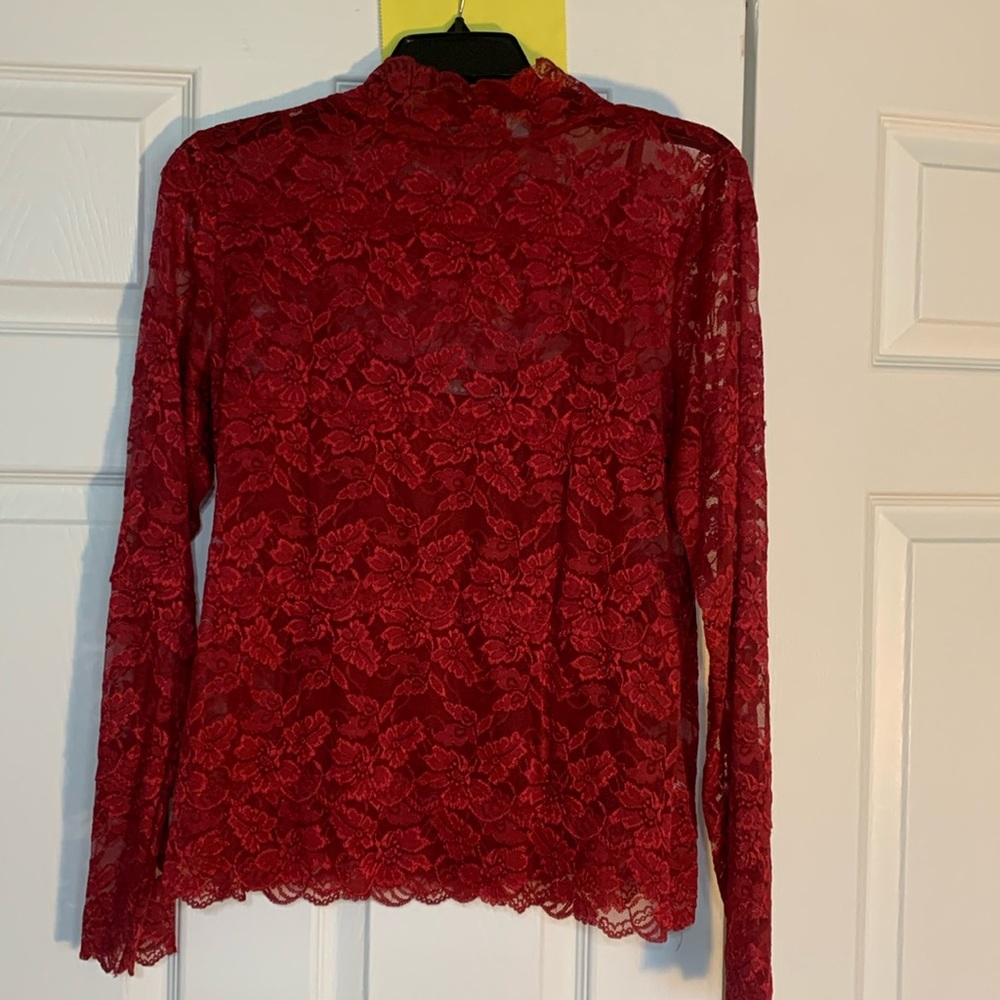 Dark red laced blouse with tank top underneath. High neck.
